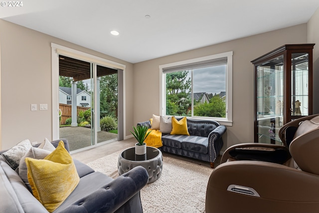 carpeted living area featuring recessed lighting