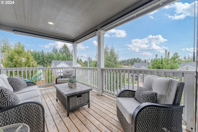 wooden terrace with outdoor lounge area