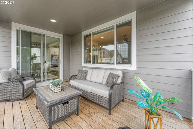 wooden terrace featuring outdoor lounge area