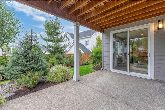 view of patio / terrace featuring fence