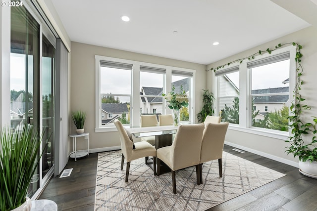 interior space featuring visible vents, baseboards, dark wood finished floors, and recessed lighting