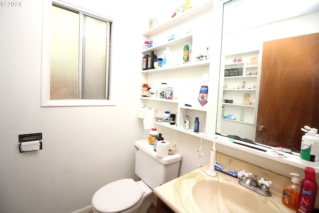 bathroom featuring sink and toilet