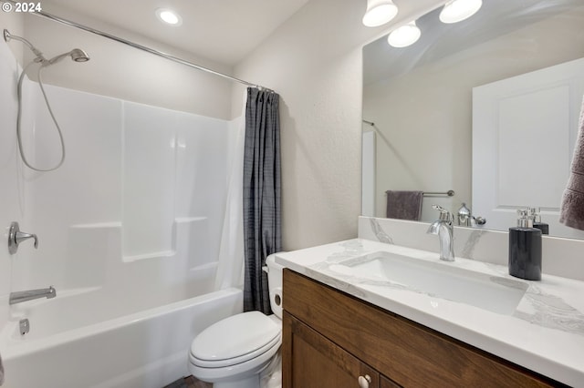 full bathroom featuring vanity, shower / bath combo, and toilet