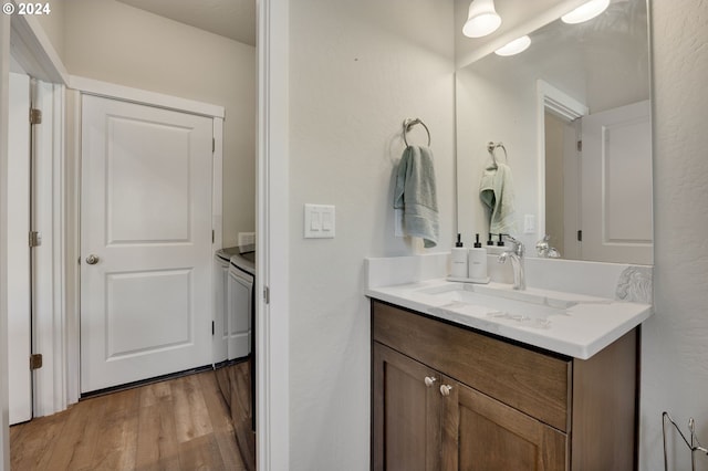 bathroom featuring vanity and wood-type flooring