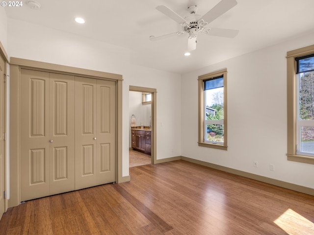 32227 Seascape Ln, Cannon Beach, OR 97110 - unfurnished bedroom featuring light wood-style floors, recessed lighting, baseboards, connected bathroom, and a closet