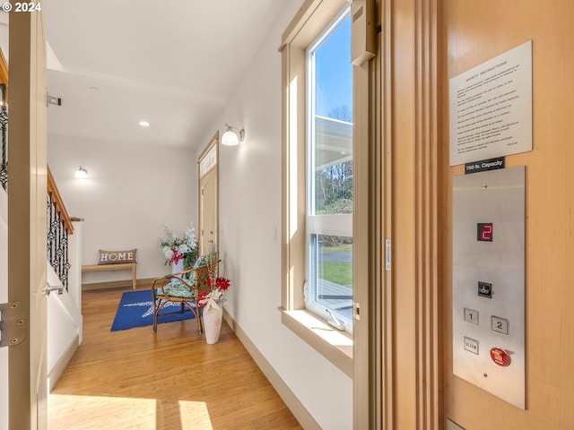 32227 Seascape Ln, Cannon Beach, OR 97110 - hallway featuring wood finished floors, stairway, baseboards, and recessed lighting