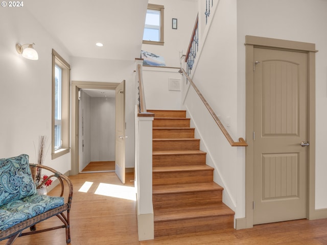 stairway featuring light hardwood / wood-style flooring