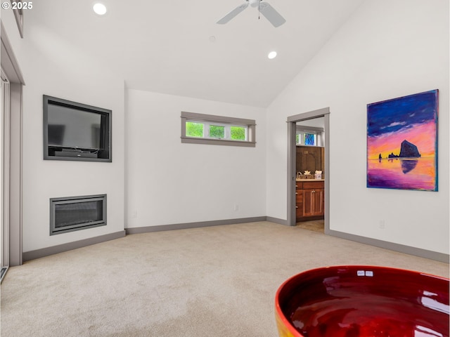 32227 Seascape Ln, Cannon Beach, OR 97110 - living room featuring light colored carpet, recessed lighting, baseboards, a ceiling fan, and high vaulted ceiling