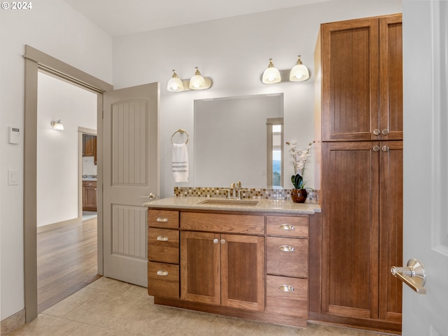 bathroom with tile floors and vanity