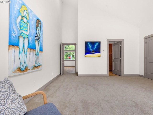 32227 Seascape Ln, Cannon Beach, OR 97110 - living area featuring carpet flooring, baseboards, and high vaulted ceiling