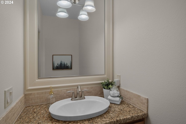 bathroom featuring backsplash and vanity