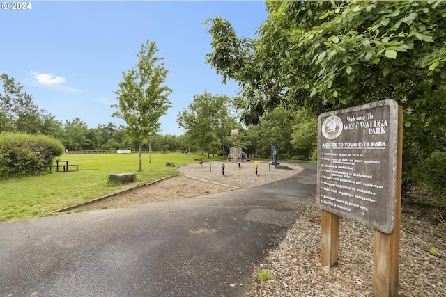 view of property's community with a lawn