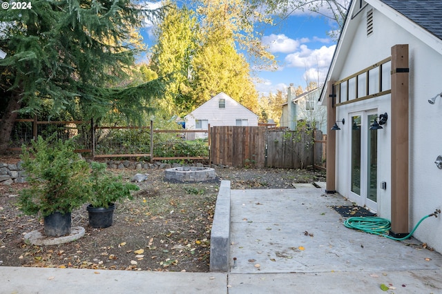 view of yard with french doors and a patio area