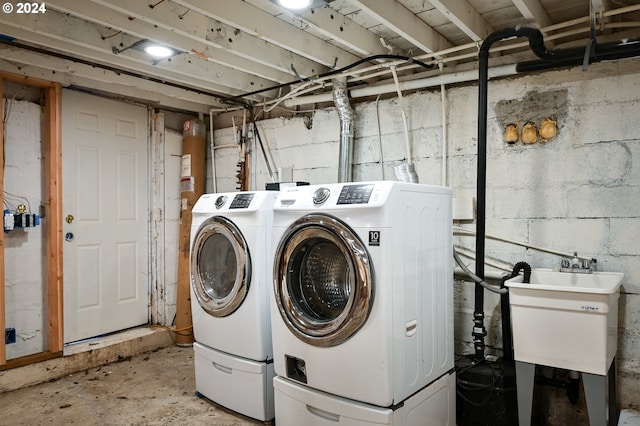 laundry area featuring washer and clothes dryer and sink