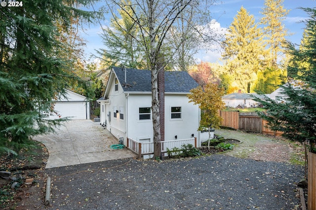 view of home's exterior with an outbuilding and a garage