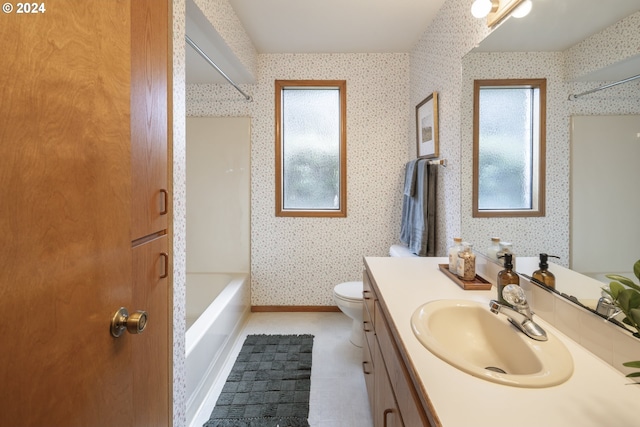 16354 SW 130th Ter Unit 76, King City, OR 97224 - bathroom with vanity, toilet, wallpapered walls, and a wealth of natural light