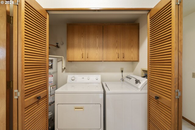 16354 SW 130th Ter Unit 76, King City, OR 97224 - clothes washing area featuring cabinet space, separate washer and dryer, and water heater