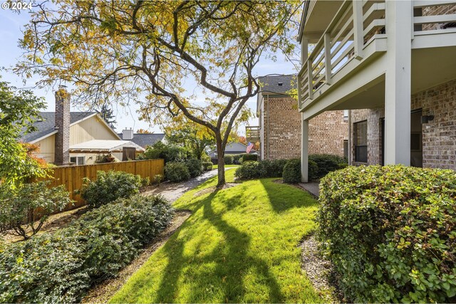 16354 SW 130th Ter Unit 76, King City, OR 97224 - view of yard featuring fence and a balcony