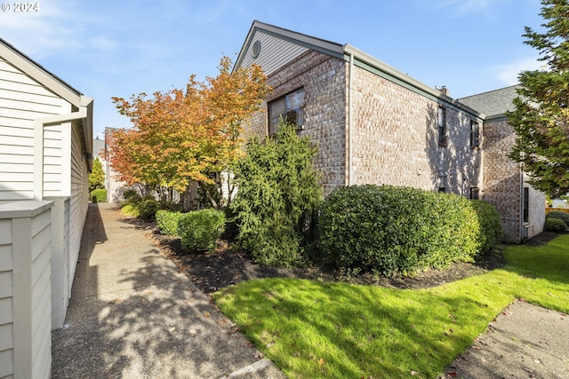 16354 SW 130th Ter Unit 76, King City, OR 97224 - view of side of home featuring brick siding