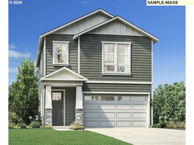 craftsman inspired home featuring a garage and a front lawn