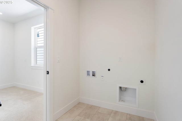 15708 NW Raywood Ln Unit L 24, Portland, OR 97229 - laundry room with hookup for an electric dryer, hookup for a washing machine, baseboards, and gas dryer hookup