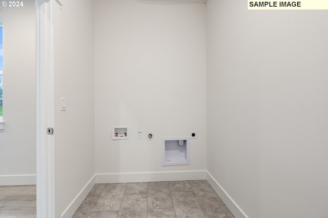 laundry room with hookup for a gas dryer, washer hookup, and hookup for an electric dryer