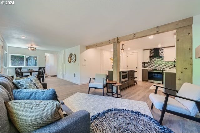 living room with light hardwood / wood-style flooring