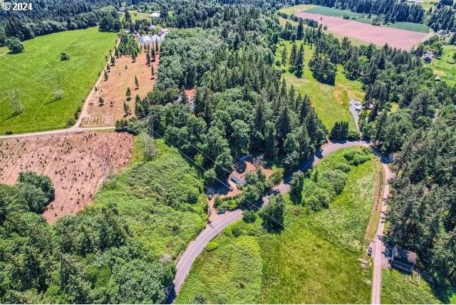 birds eye view of property featuring a rural view