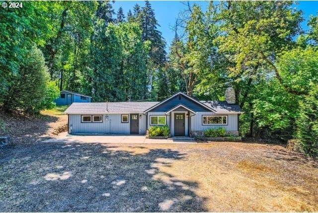 ranch-style house with an outbuilding