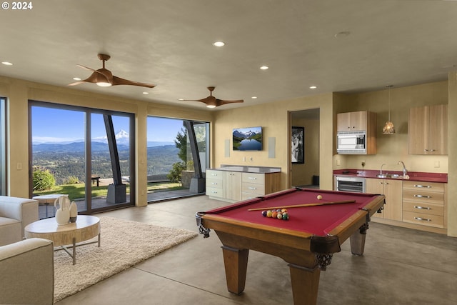 game room with ceiling fan, sink, wine cooler, billiards, and a mountain view