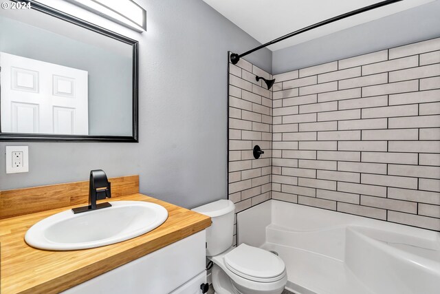 bathroom featuring toilet and oversized vanity