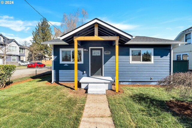 bungalow with a front lawn