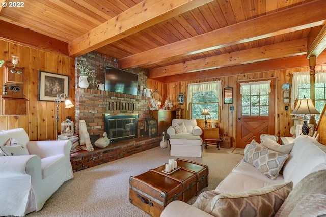 living room featuring wood ceiling, a brick fireplace, wood walls, and beamed ceiling