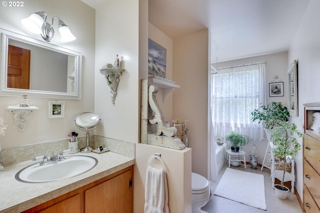 bathroom with vanity and toilet