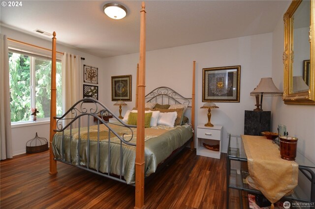 bedroom featuring dark wood-type flooring