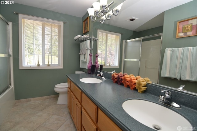 full bathroom with lofted ceiling, toilet, bath / shower combo with glass door, vanity, and tile patterned flooring