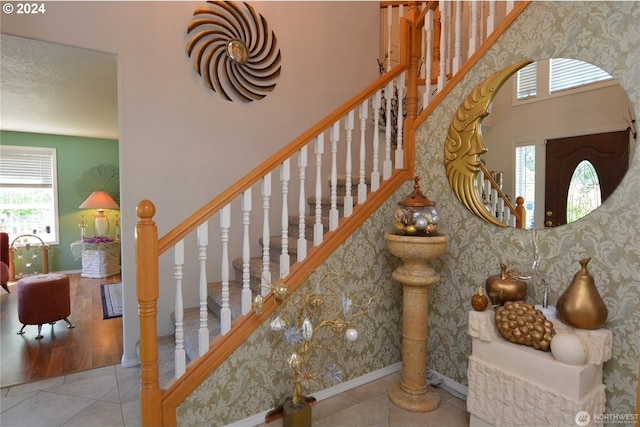 stairs with tile patterned floors