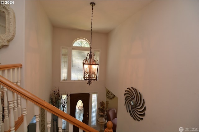 foyer featuring an inviting chandelier