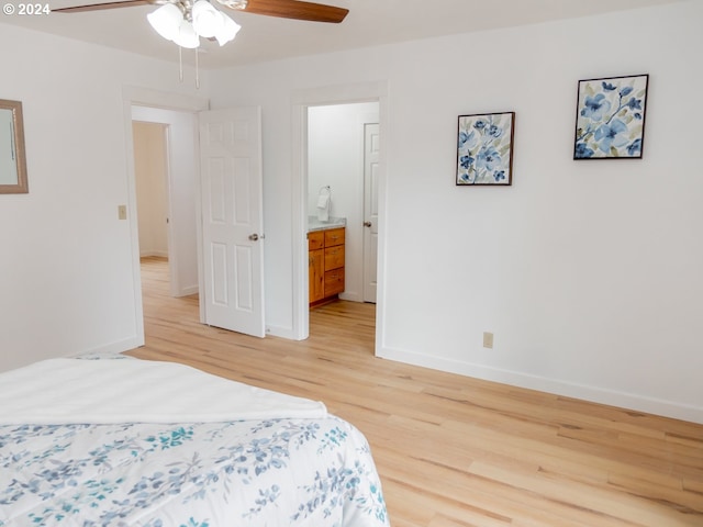 bedroom with ensuite bathroom, ceiling fan, and light hardwood / wood-style floors