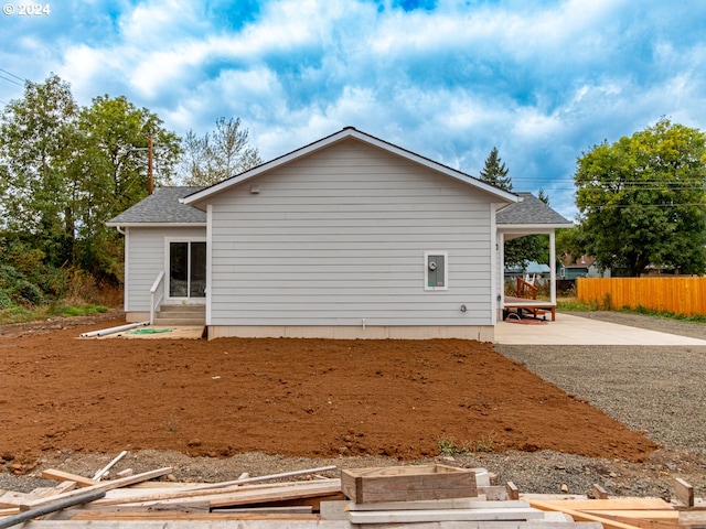 view of property exterior with a patio area