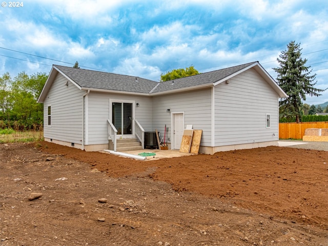 rear view of house with cooling unit