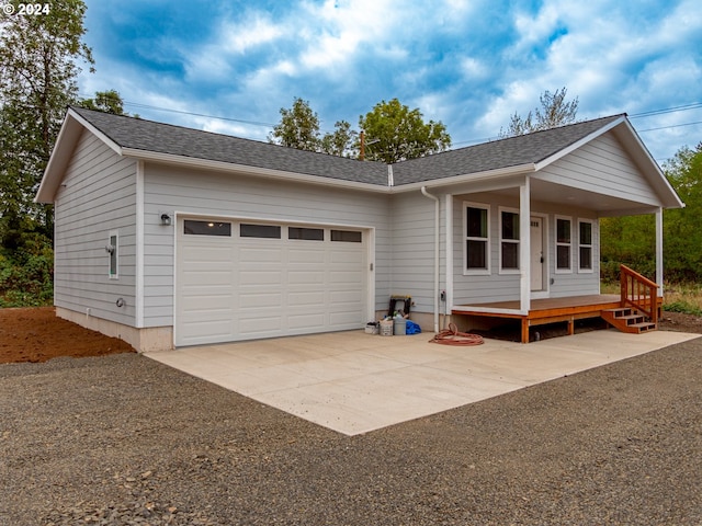 view of front facade featuring a garage and a porch