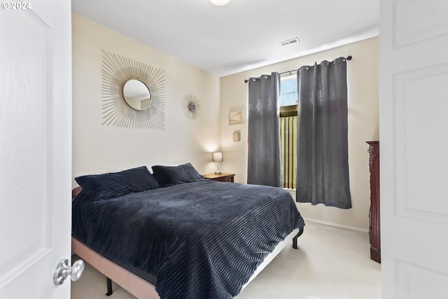 bedroom with baseboards, carpet, and visible vents