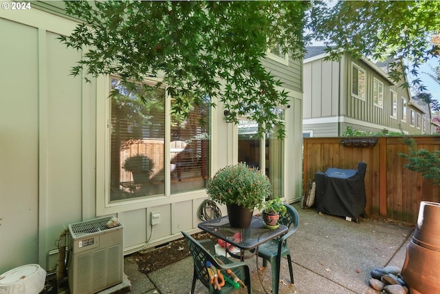 view of patio with fence and area for grilling