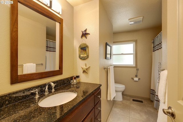 34215 E Lacomb Rd, Lebanon, OR 97355 - bathroom featuring baseboard heating, tile patterned flooring, vanity, toilet, and visible vents