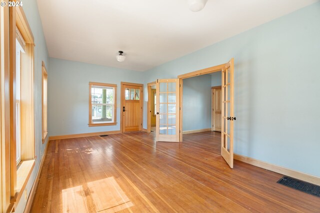 interior space featuring hardwood / wood-style floors and french doors