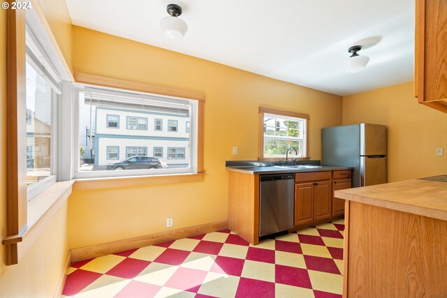 kitchen with appliances with stainless steel finishes and sink