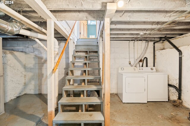 basement with washer and clothes dryer