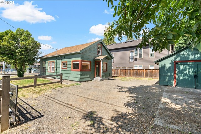 bungalow-style house with an outbuilding