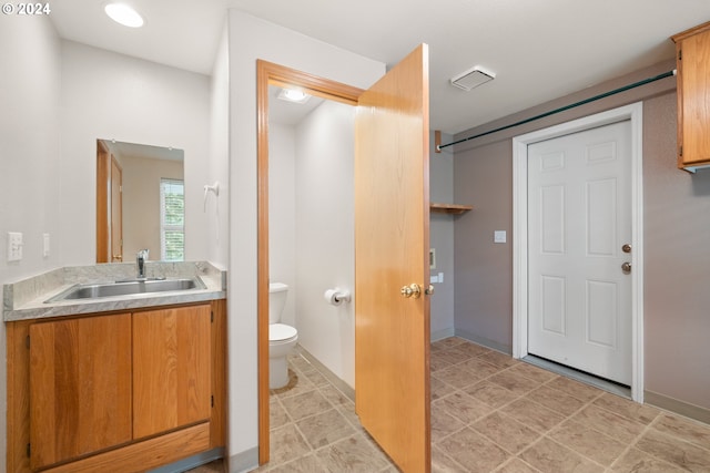 bathroom featuring vanity and toilet